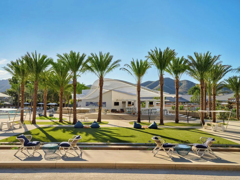 Four Seasons Hotel Los Angeles at Beverly Hills pool terrace with palm trees and Hollywood Hills views