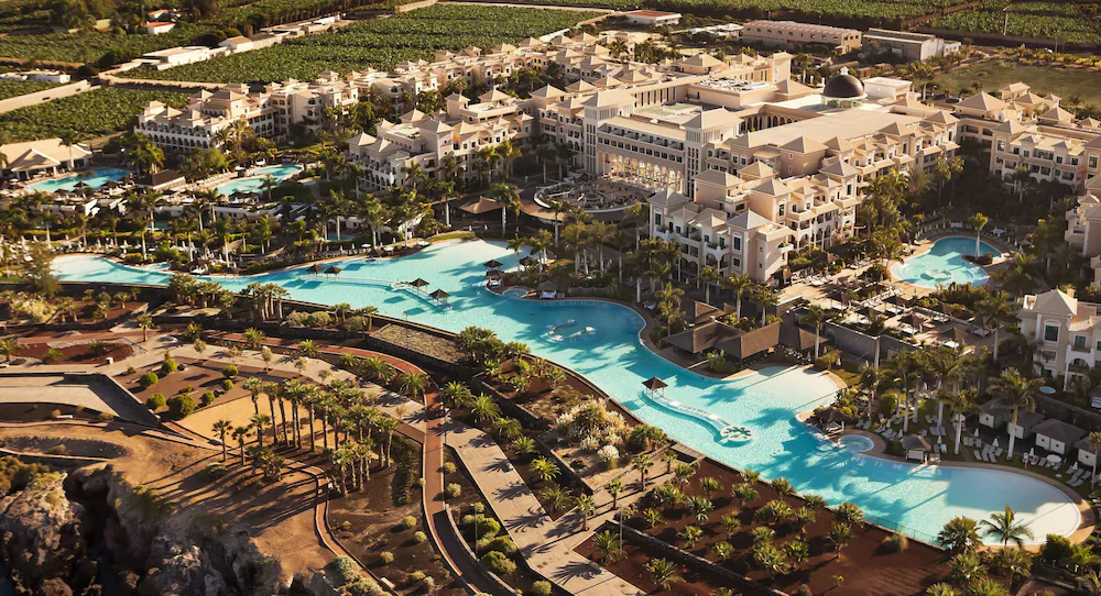 Gran Melia Palacio de Isora - Tenerife - Aerial view of the hotel and pool beside the seafront promenade